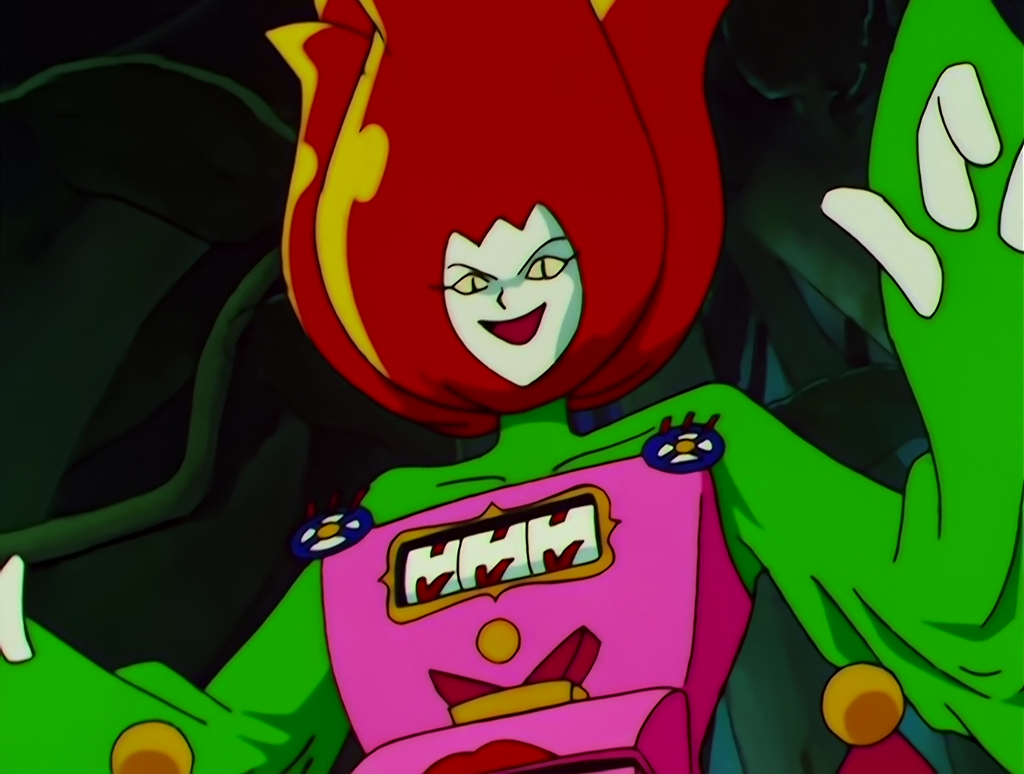 JaraJara Jou, a Lemures from Sailor Moon episode 154. Her head resembles a large red tulip with a white face on the front. She wears green on her torso, arms and neck. Her chest is a bulky pink slot machine, with the reels halfway between three 7s and three Ks.
